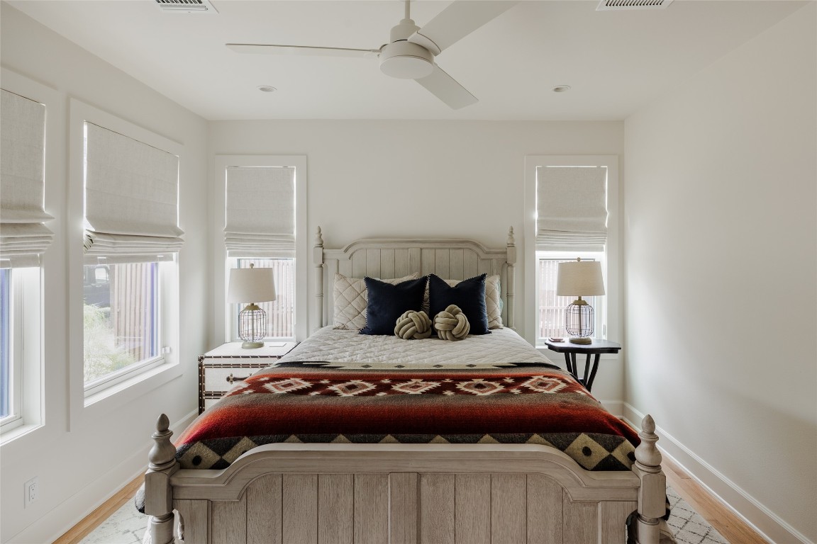 2613 East 2nd Street Austin, TX 78702 - Photo 24 of 30 a bedroom with a bed and window