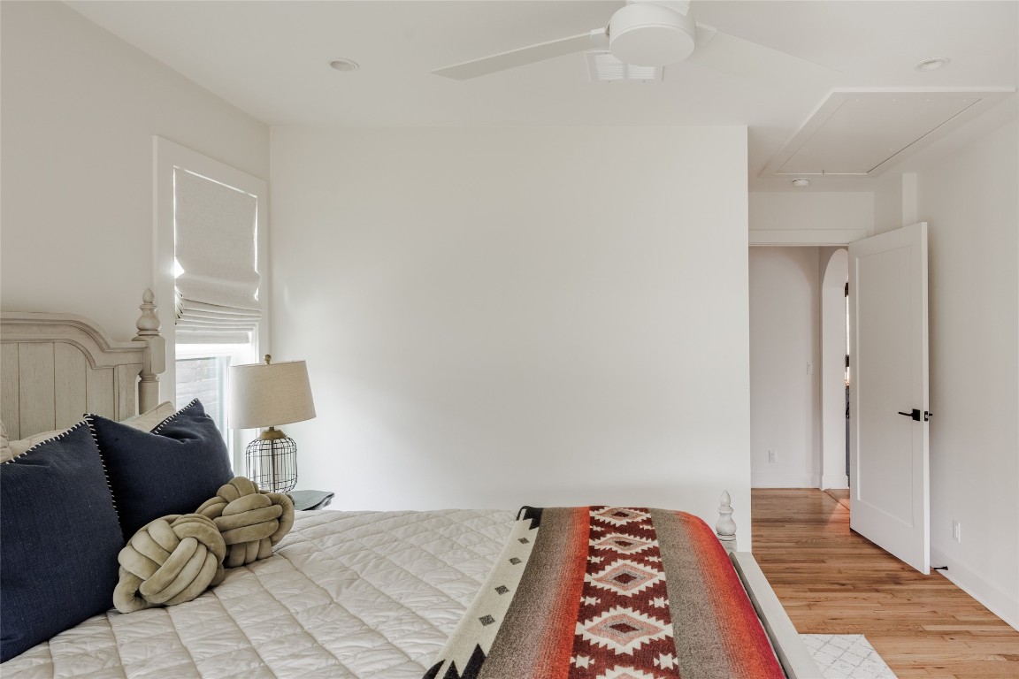 2613 East 2nd Street Austin, TX 78702 - Photo 25 of 30 a bedroom with a bed and a lamp