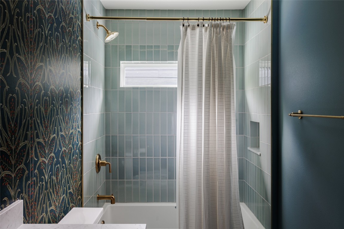 2613 East 2nd Street Austin, TX 78702 - Photo 27 of 30 a bathroom with a shower and a sink
