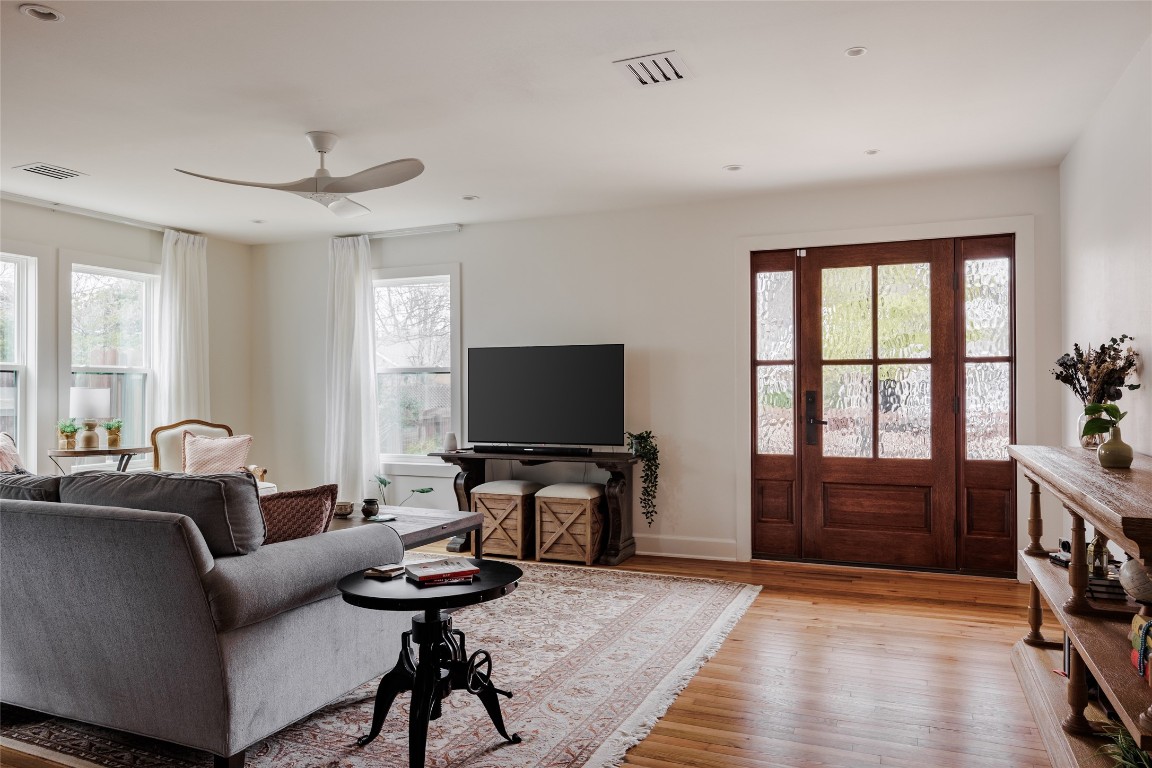 2613 East 2nd Street Austin, TX 78702 - Photo 5 of 30 a living room with furniture a flat screen tv and a window