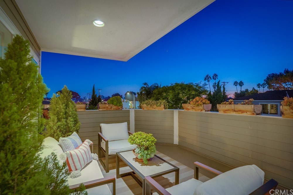 a view of a chairs and table in patio