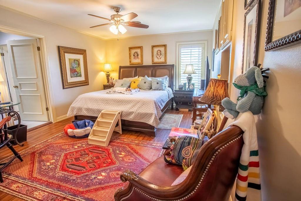 149 Russ Street Albany, TX 76430 - Photo 19 of 25 a bedroom with furniture and a window