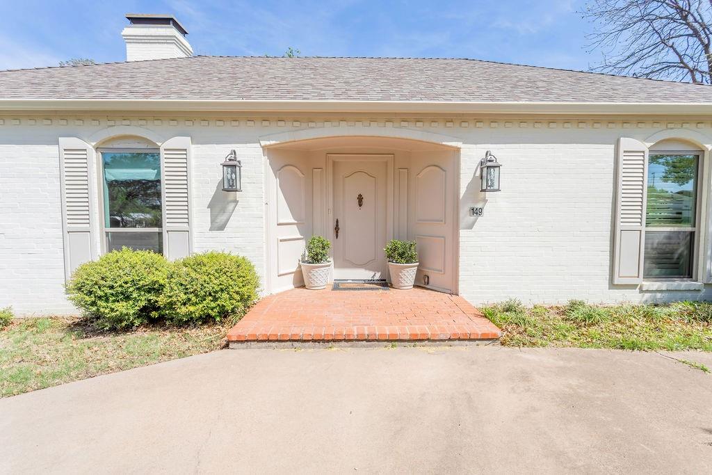 149 Russ Street Albany, TX 76430 - Photo 2 of 25 a front view of a house with garden