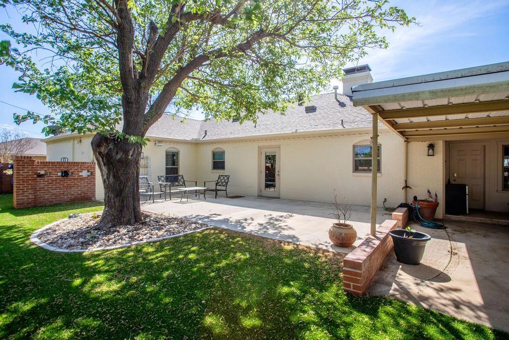 149 Russ Street Albany, TX 76430 - Photo 25 of 25 a front view of a house with garden