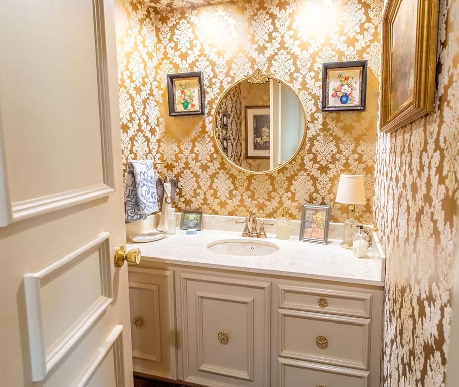 149 Russ Street Albany, TX 76430 - Photo 5 of 25 a bathroom with a sink and a mirror