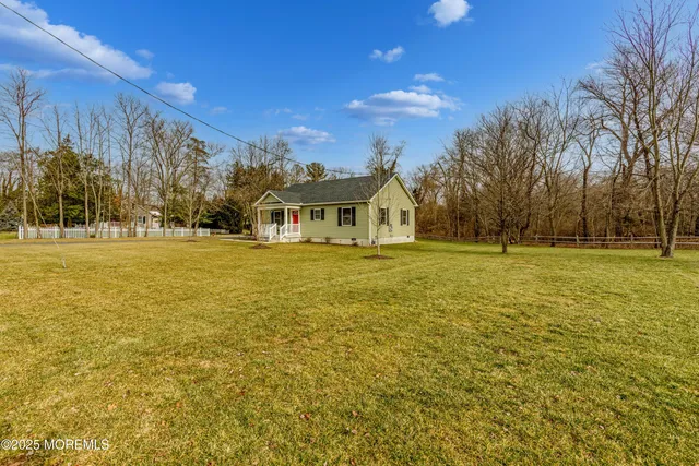 a view of an ocean with a building in the background