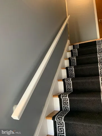a kitchen with a refrigerator stove and sink