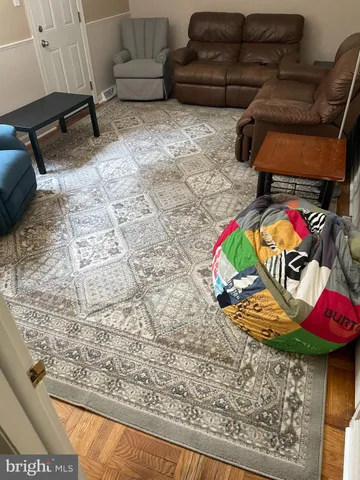 a view of balcony with wooden floor and outdoor seating