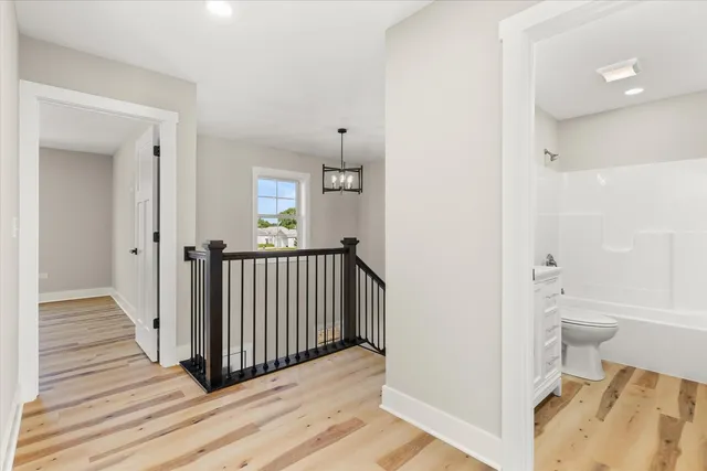 a view of a bathroom from the hallway