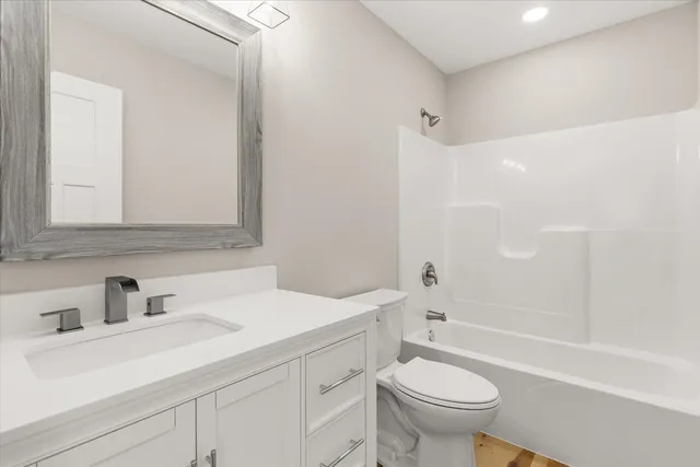 a bathroom with a sink a toilet and a bathtub