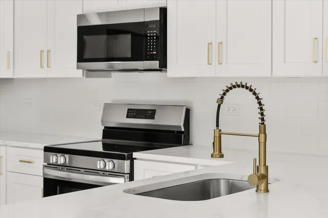 a kitchen with a sink and a microwave