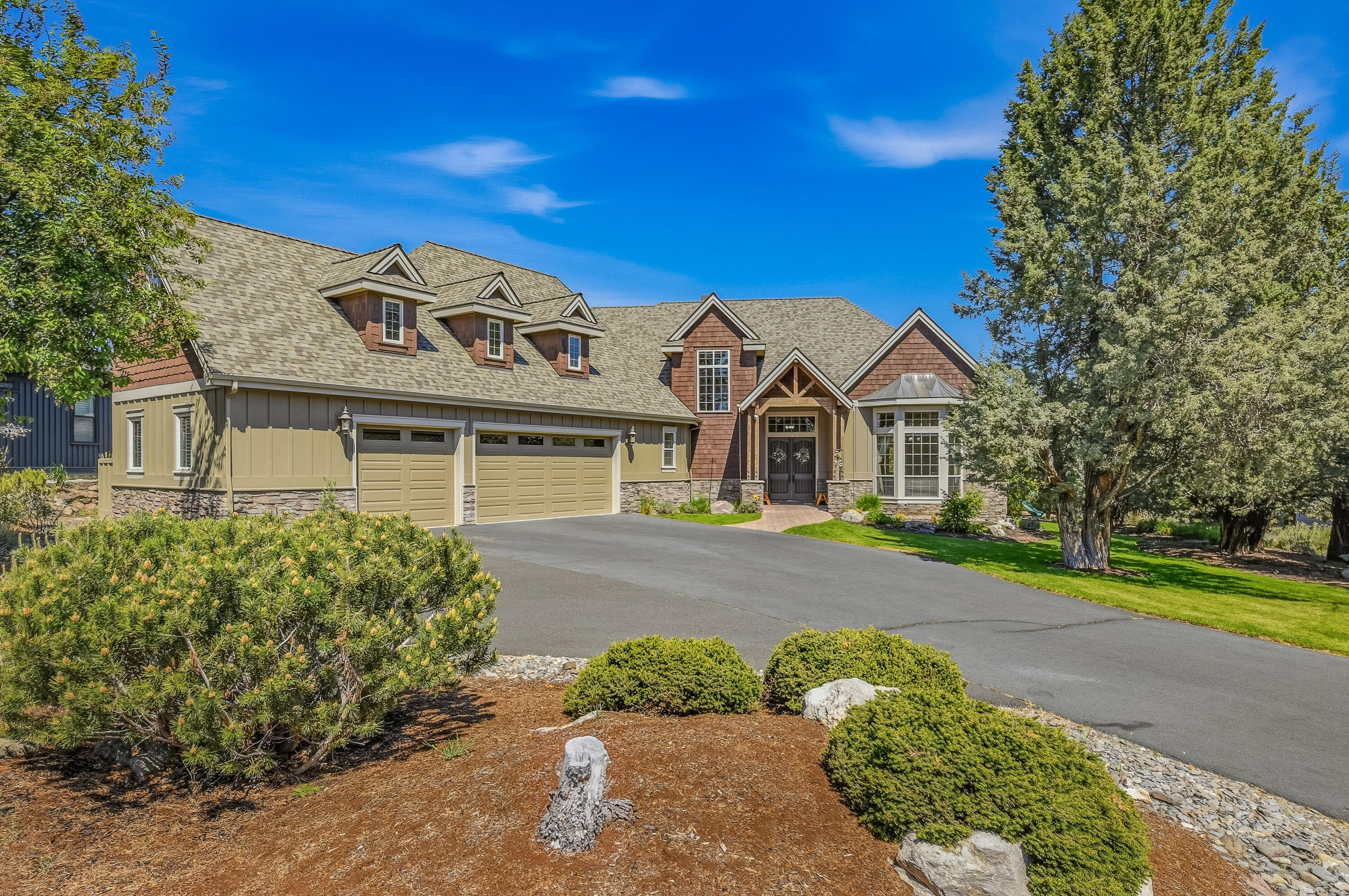 9009 Merlin Drive Redmond, OR 97756 - Photo 3 of 98 a front view of a house with a yard