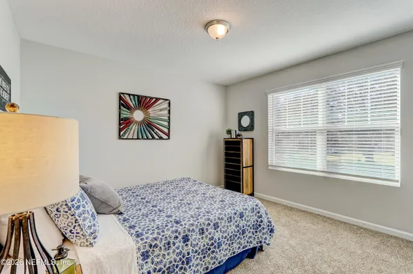 a bedroom with a bed and a cabinets