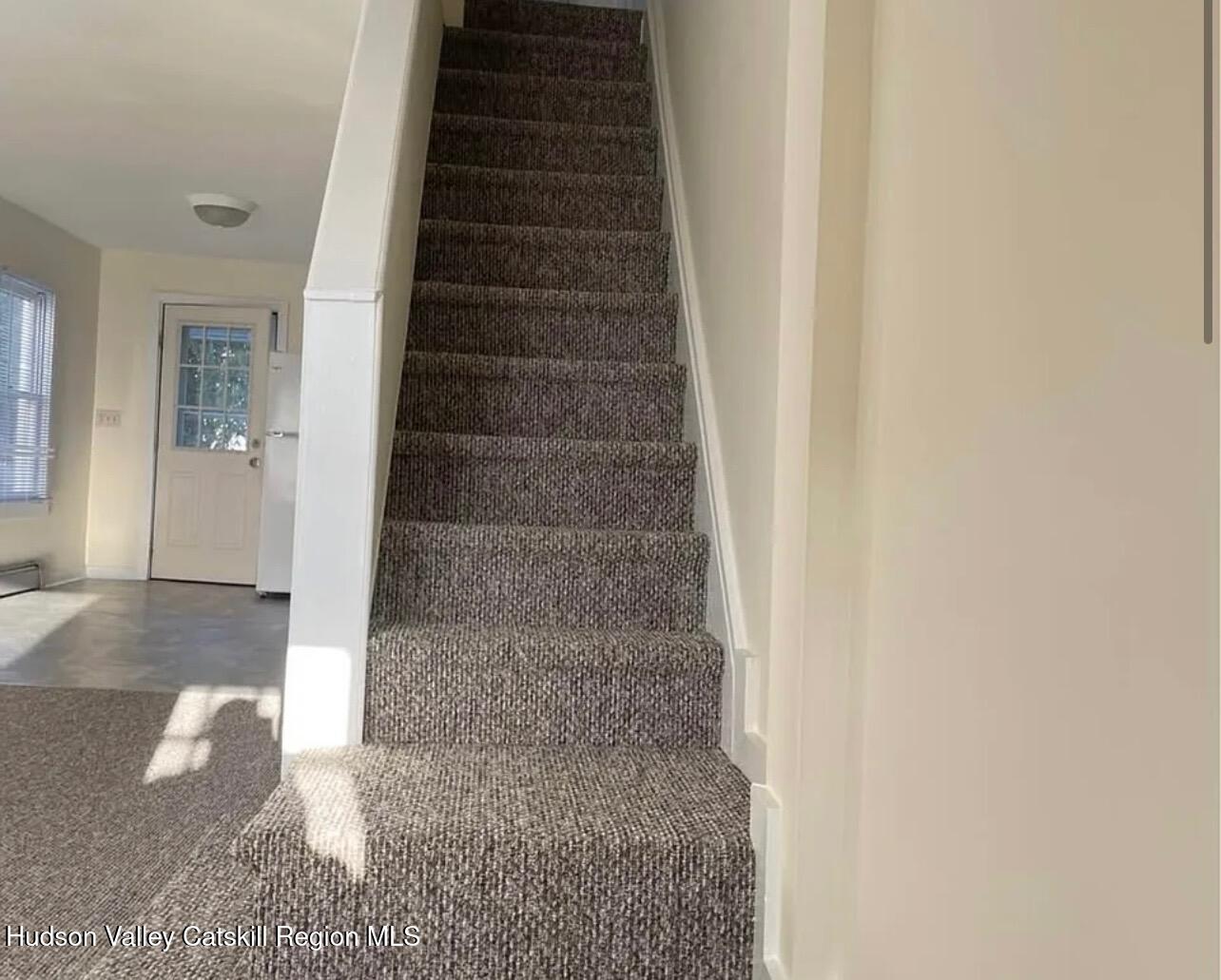 252-254 Partition Street Saugerties, NY 12477 - Photo 3 of 11 a view of staircase with white walls