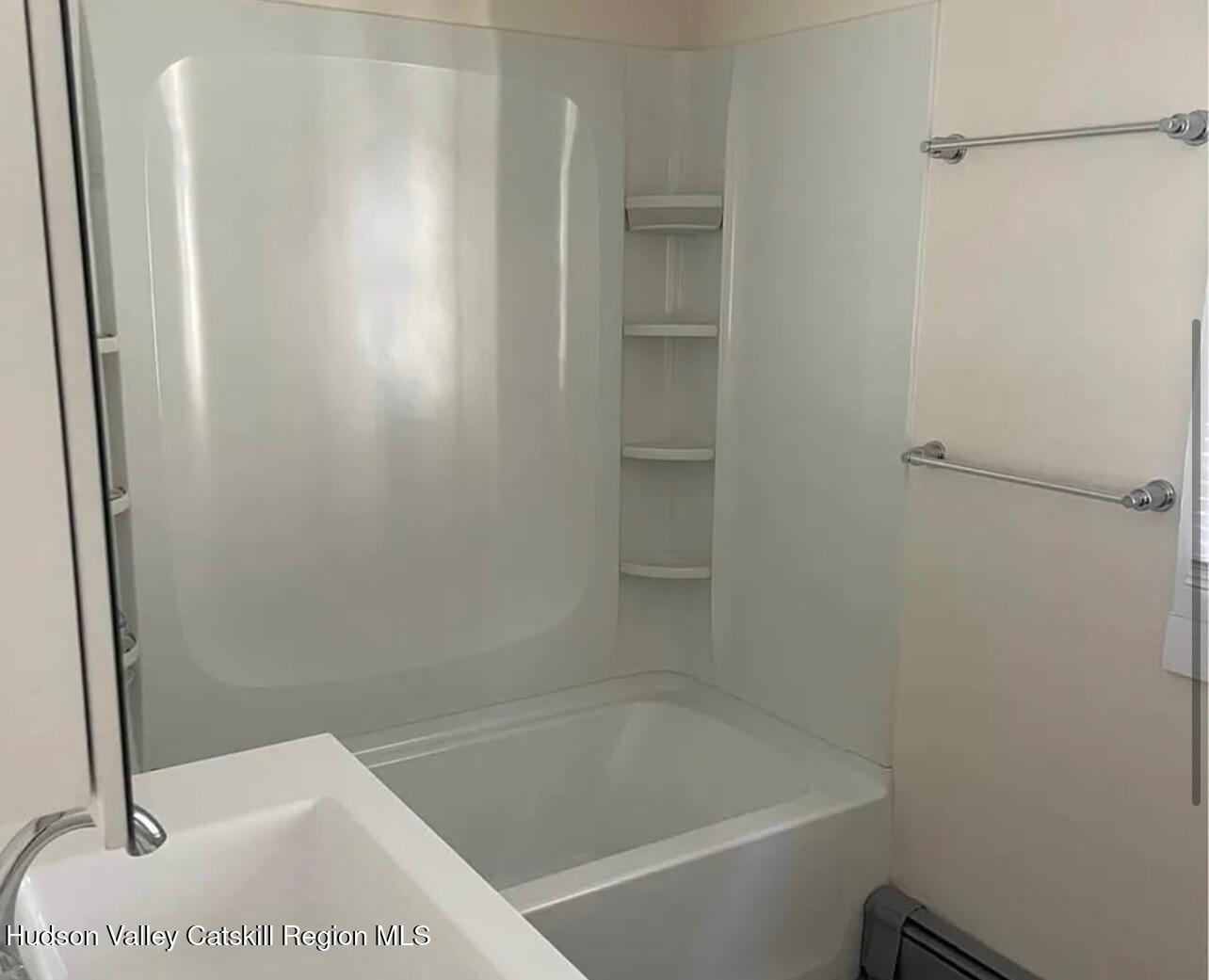 252-254 Partition Street Saugerties, NY 12477 - Photo 9 of 11 a bathroom with a bathtub