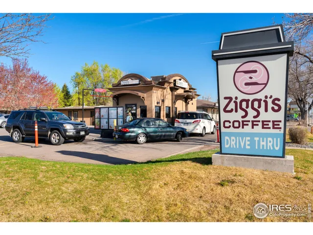 a view of outdoor space with signage and flags