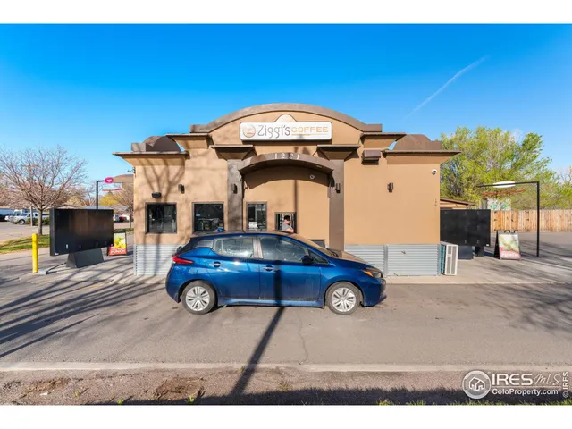 a front view of a house with parking space