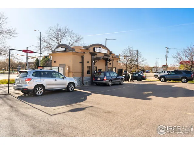 a view of a cars parked in front of a building