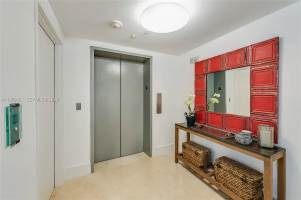 a bedroom with a bed and a mirror