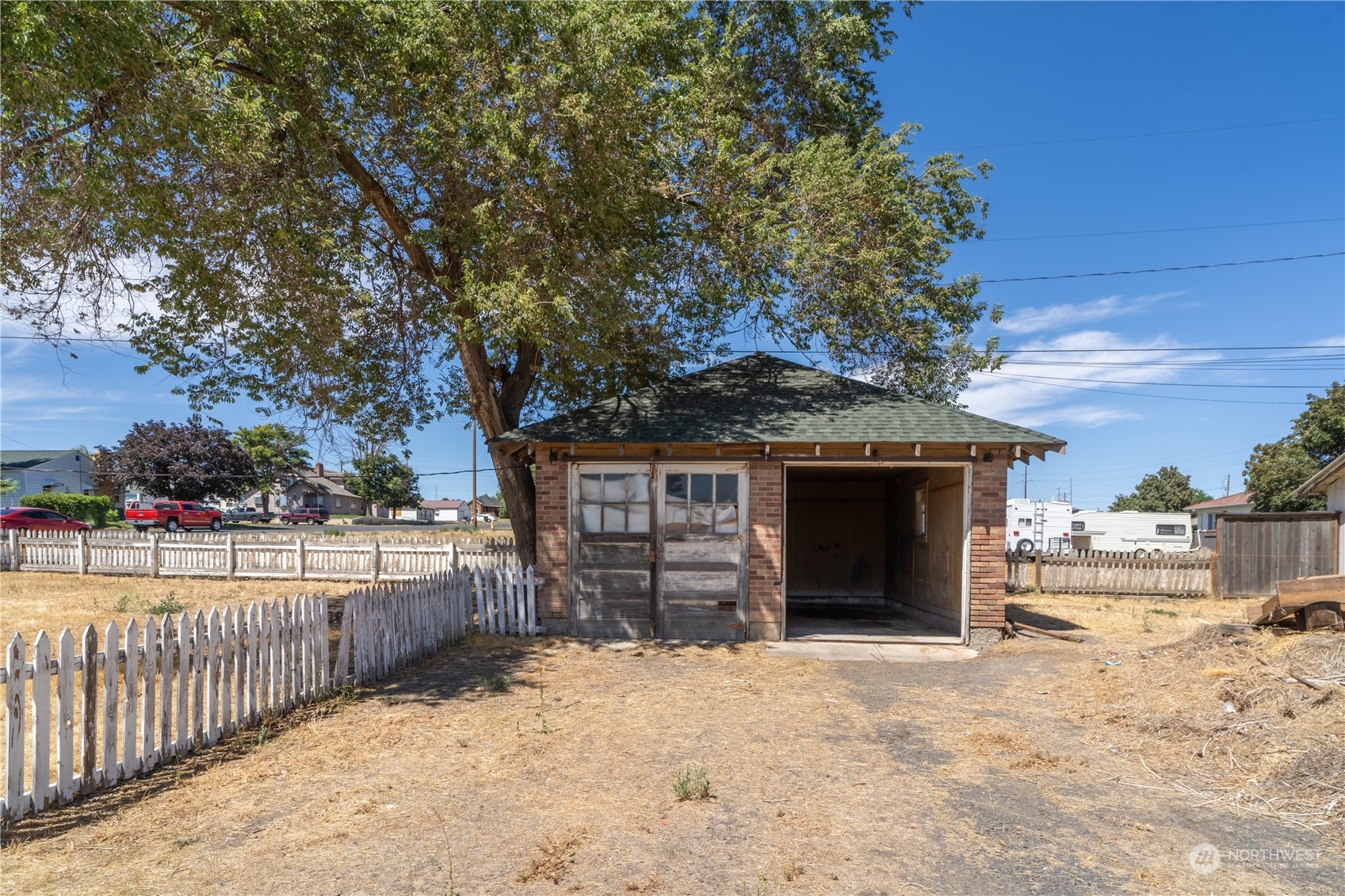 506 North I Street Lind, WA 99341 - Photo 14 of 40 a front view of a house with a yard and garage