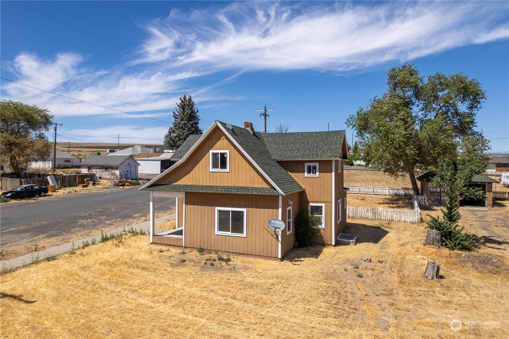 506 North I Street Lind, WA 99341 - Photo 4 of 40 a front view of a house with a yard covered with snow