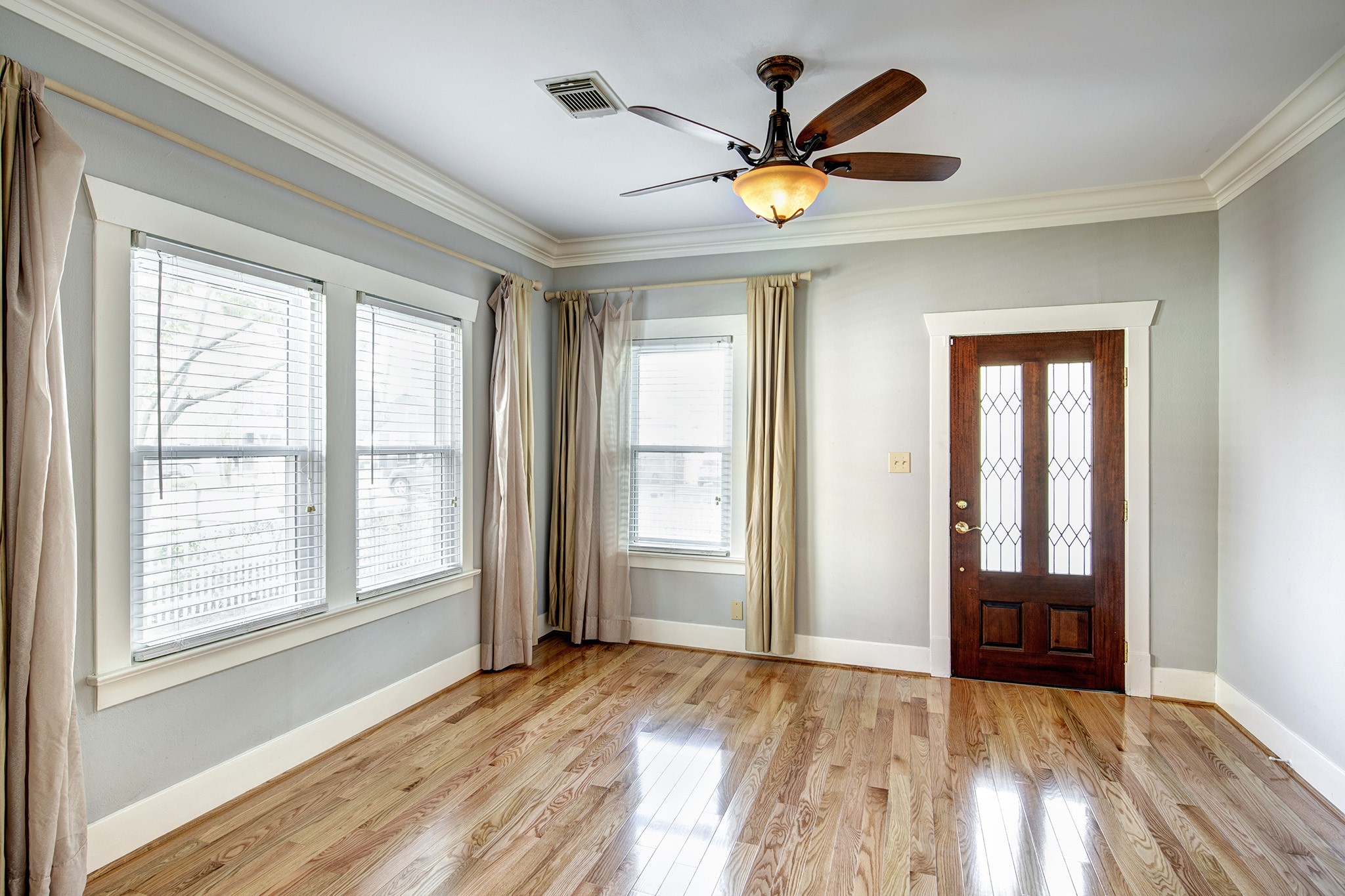2219 Singleton Street Houston, TX 77008 - Photo 2 of 21 Living room with window treatments and privacy blinds.
