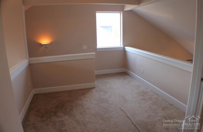 63595 Northeast Boyd Acres Road Bend, OR 97701 - Photo 14 of 22 loft is open to foyer on one side and gr
