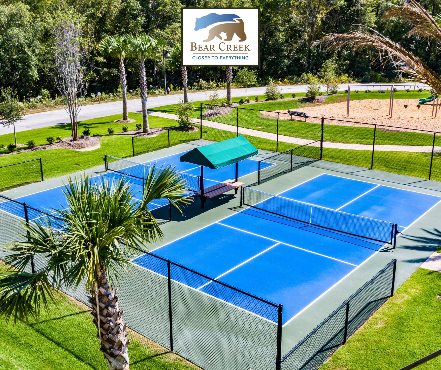 123 Sun Bear Circle Freeport, FL 32439 - Photo 7 of 14 a view of a tennis ground with large trees