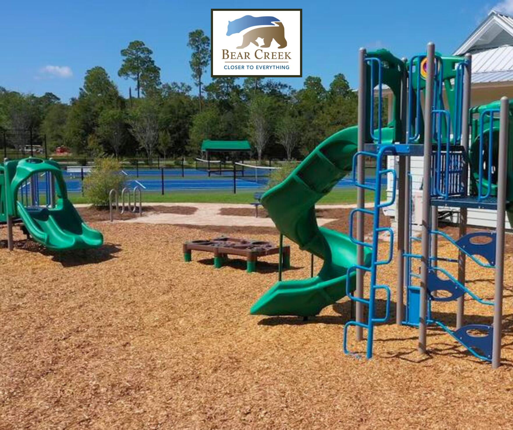 123 Sun Bear Circle Freeport, FL 32439 - Photo 10 of 14 a view of a park with swings and slides