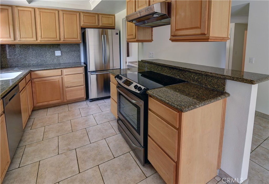 33381 Ocean Hill Drive Dana Point, CA 92629 - Photo 12 of 45 a kitchen with stainless steel appliances granite countertop a stove a refrigerator and a sink