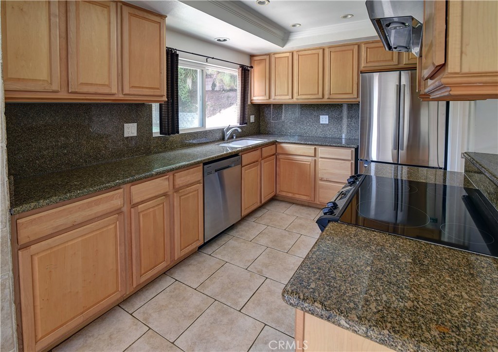 33381 Ocean Hill Drive Dana Point, CA 92629 - Photo 13 of 45 a kitchen with a sink refrigerator and cabinets