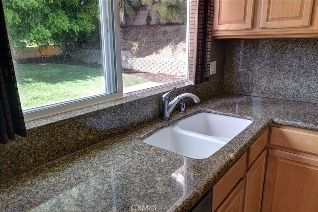 33381 Ocean Hill Drive Dana Point, CA 92629 - Photo 17 of 45 a kitchen with granite countertop a sink and a window