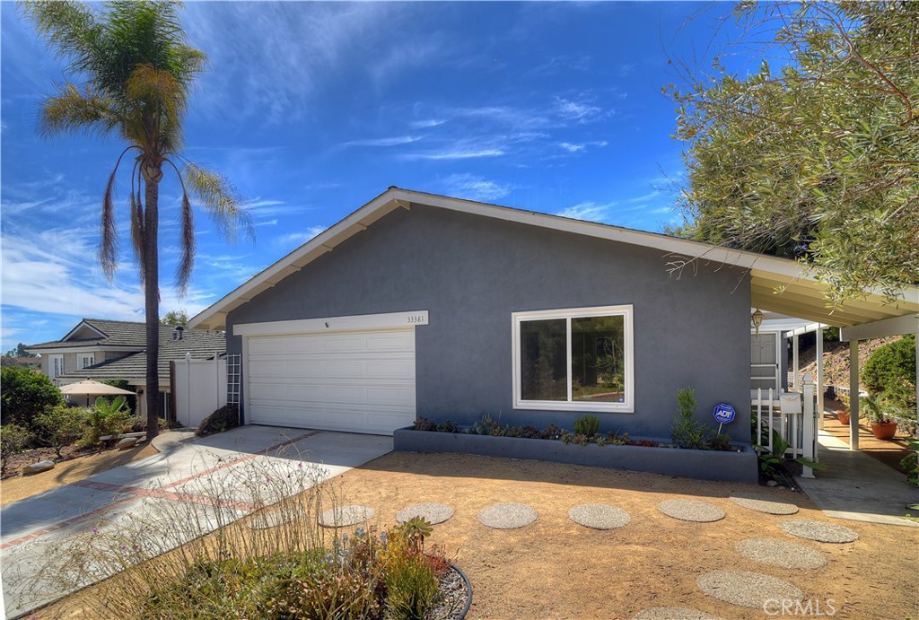 33381 Ocean Hill Drive Dana Point, CA 92629 - Photo 2 of 45 a front view of a house with a yard