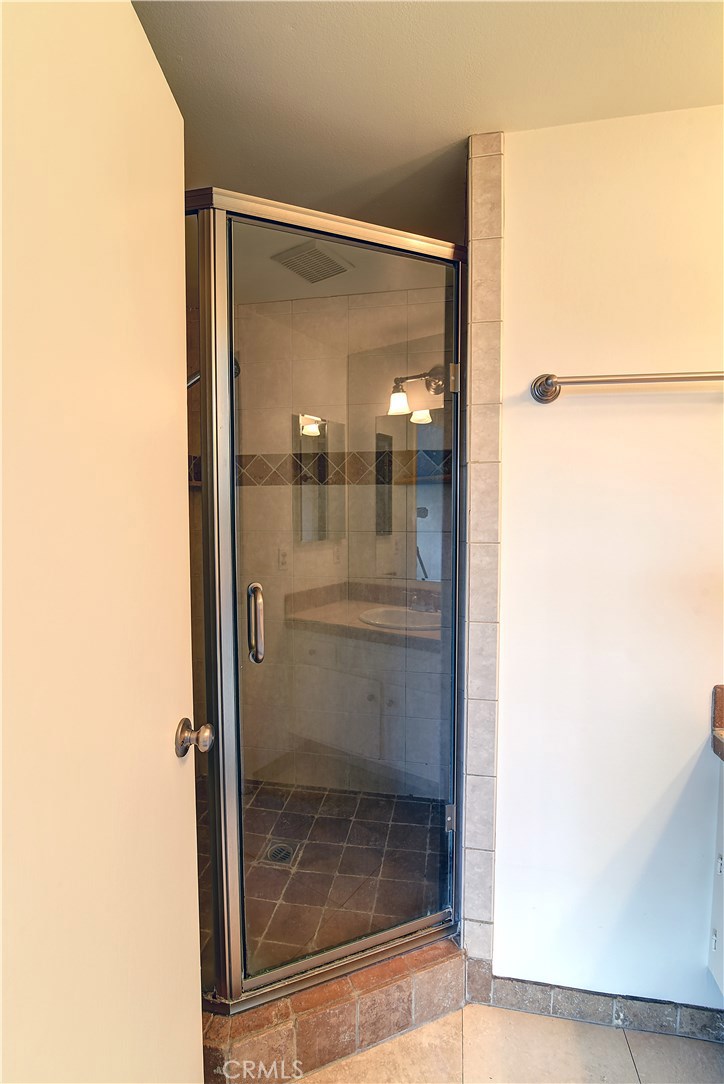 33381 Ocean Hill Drive Dana Point, CA 92629 - Photo 22 of 45 a bathroom with a glass shower door