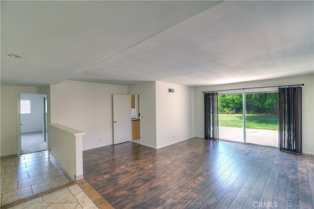 33381 Ocean Hill Drive Dana Point, CA 92629 - Photo 6 of 45 a view of an empty room with wooden floor and a window