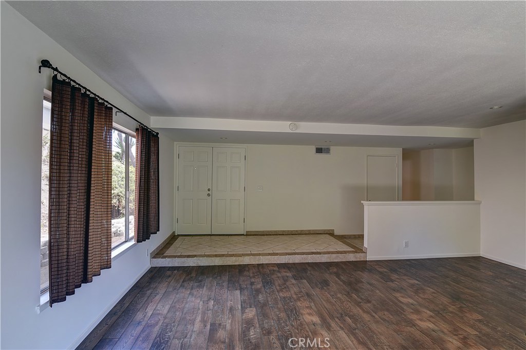 33381 Ocean Hill Drive Dana Point, CA 92629 - Photo 9 of 45 wooden floor in an empty room with a window