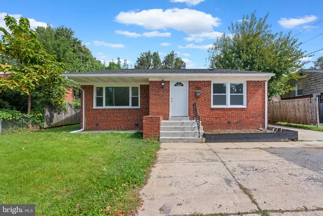 a front view of a house with yard