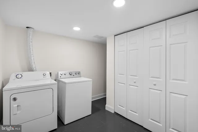 a view of storage and utility room with washer and dryer