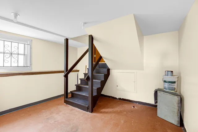 a view of entryway with wooden floor and stairs