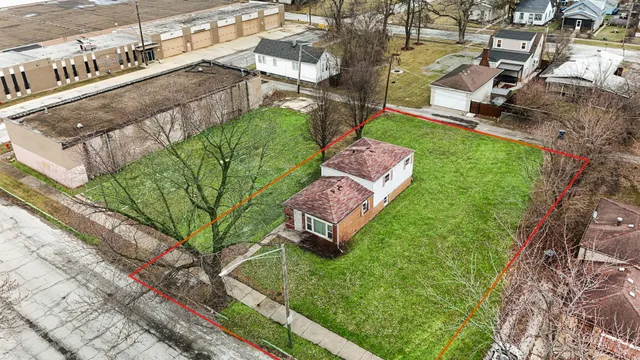 a view of a backyard with sitting area