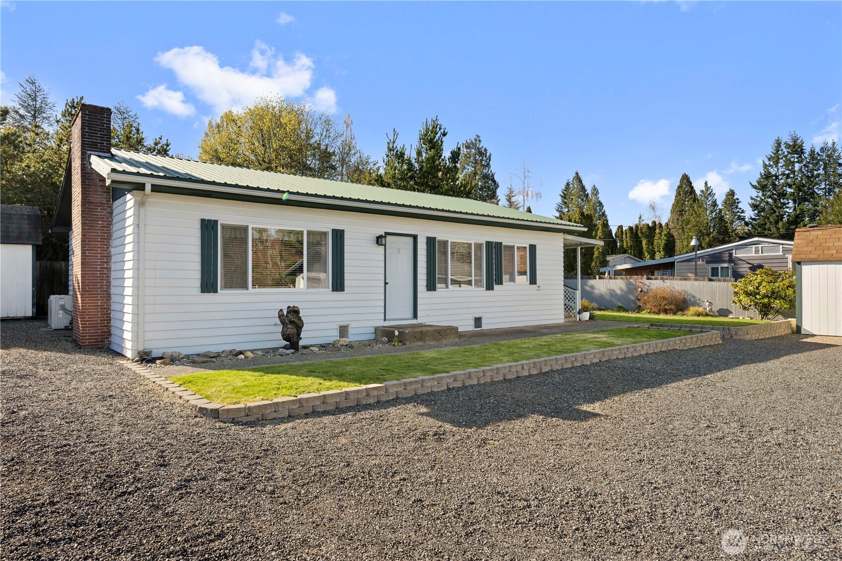 915 128th Street Southwest Everett, WA 98204 - Photo 1 of 25 a view of a house with swimming pool and a yard