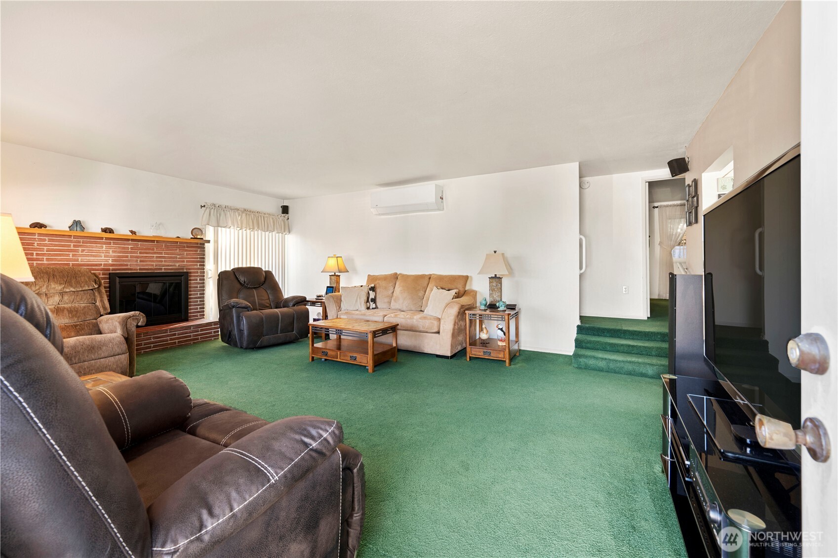 915 128th Street Southwest Everett, WA 98204 - Photo 5 of 25 a living room with furniture and a fireplace
