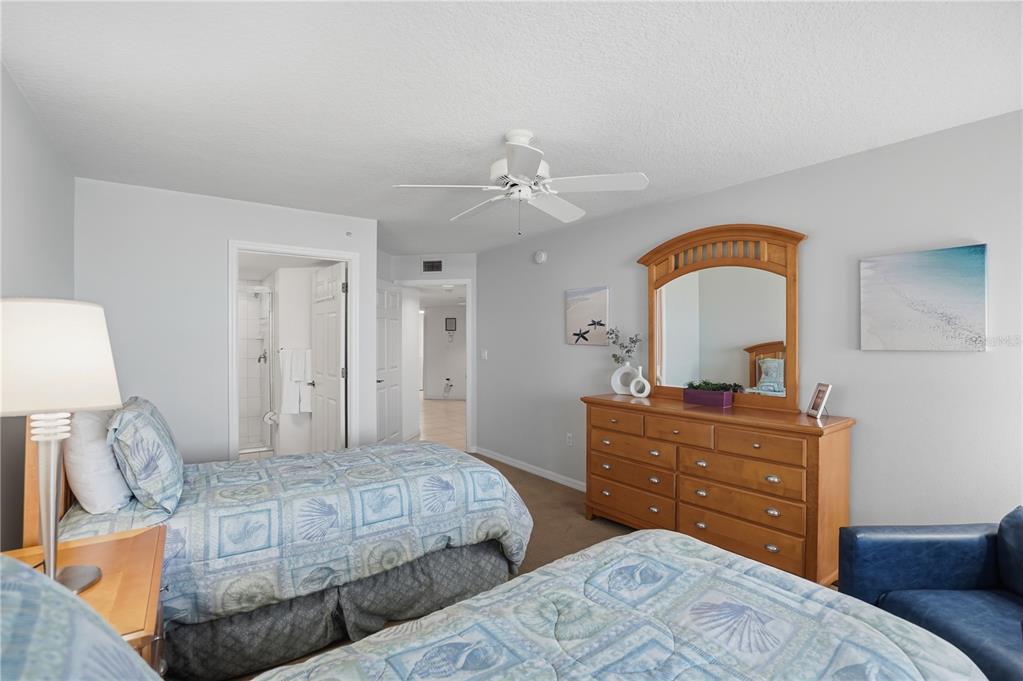 16326 Gulf Boulevard, Unit 307 Redington Beach, FL 33708 - Photo 26 of 43 a bedroom with a bed and a dresser
