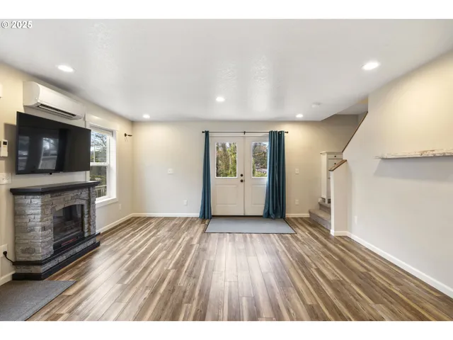 a view interior of a house with an empty space and a fireplace