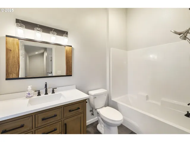 a view of balcony with wooden floor and fence