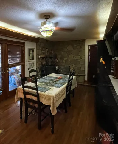a view of a dining room with furniture and chandelier