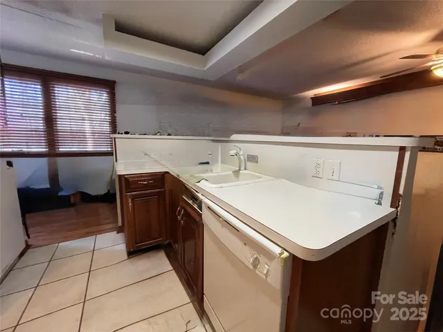 a utility room with sink dryer and washer