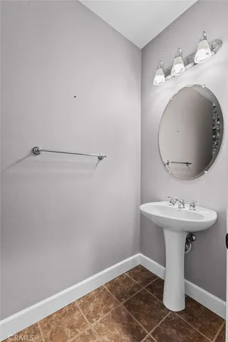a bathroom with a sink and vanity
