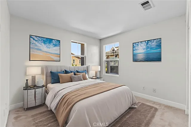 a bedroom with a bed and a painting on the wall