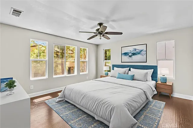 a bedroom with a large bed and a window